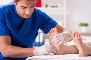a senior receives podiatry care services by having a doctor examine their foot